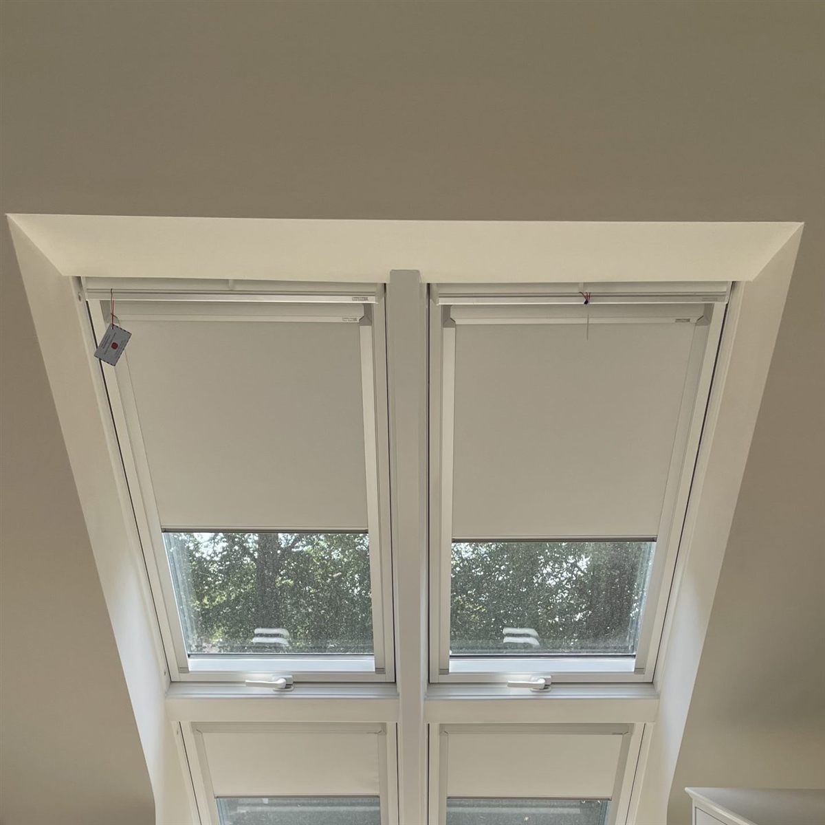 Blackout skylight blinds fitted to roof windows in a loft conversion by Vesta Blinds